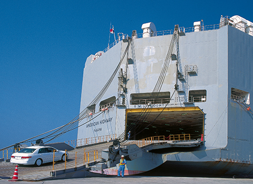 Car driving into cargo ship Thailand Port