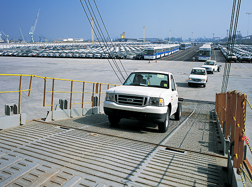 Loading cars to cargo ship Cars loading into a cargo ship in Thailand