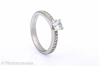 Gold ring with diamonds On the white background