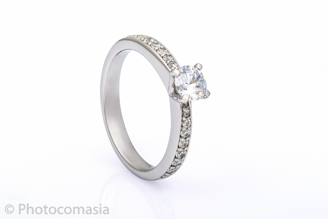 Gold ring with diamonds On the white background