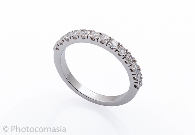 Gold ring with diamonds On the white background